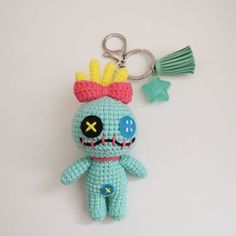 a crocheted keychain with a skull on it