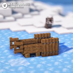 an animal made out of wood sitting in the snow