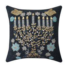 a decorative pillow with a menorah design on it