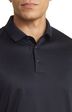 Classic and comfortable, this polo enriched with soft cotton makes a great choice for everyday and always keeps you looking smart. 27" length (size Medium) Button half-placket Spread collar Short sleeves 70% lyocell, 30% cotton Machine wash, line dry Imported Navy Formal Polo Shirt, Elegant Business Casual Polo Shirt With Button Closure, Elegant Business Casual Polo Shirt, Classic Blue Polo Shirt For Formal Occasions, Elegant Blue Polo Shirt For Workwear, Elegant Blue Polo Shirt For Work, Cotton Polo, Emporio Armani, Short Sleeves