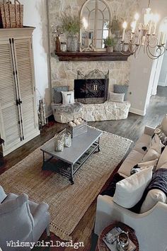 a living room filled with furniture and a fire place in the middle of a room