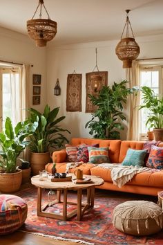 a living room filled with lots of furniture and potted plants on top of them