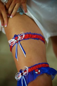 a woman wearing red, white and blue garter with bows on her butts