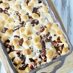 a baking dish filled with marshmallows and pecans