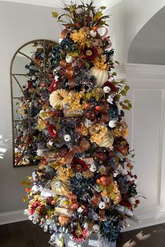 a decorated christmas tree in the corner of a room