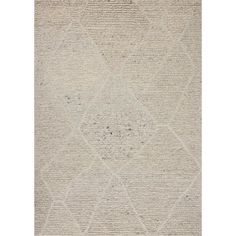 an area rug with white and beige colors