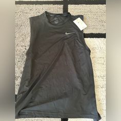 Brand New Nike Dri Fit Shirt. Black Tank T-shirt For Workout, Nike Sporty Sleeveless Vest, Nike Sleeveless Sports Vest, Nike Casual Sleeveless Vest, Casual Nike Sleeveless Vest, Black Sleeveless Workout Top, Black Fitted Sleeveless T-shirt, Nike Sporty Sleeveless Tops, Sporty Sleeveless Nike Top