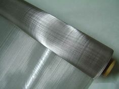 a roll of stainless steel cloth on a table