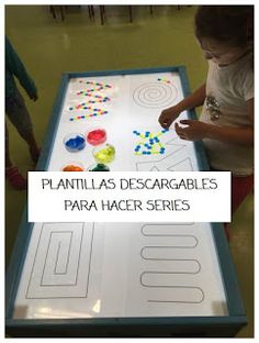 a young child is playing with an interactive board that teaches shapes and numbers in spanish