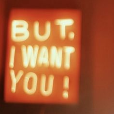 a neon sign that says, but i want you on the side of a wall