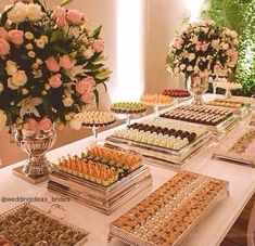 a table filled with lots of different types of desserts