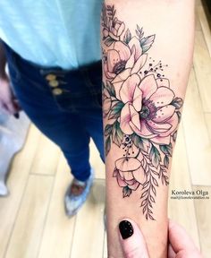 a woman's arm with flowers on it and the words instagramn above her