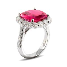 This is a beautiful platinum ring featuring a cushion cut pink sapphire surrounded by diamonds. Round brilliant diamonds encircle the cushion cut pink sapphire in a platinum bezel setting. Also, pink sapphire, carat total weight 7.25, round brilliant diamonds, carat total weight 2.06cts. Pink sapphires are given for the 5th, 23rd, and 45th wedding anniversaries, and often gifted on the 65th anniversary. This wedding & engagement ring will cherish your wife as her ring as well as pass it down for Formal Pink Sapphire Rings With Cushion Cut, Formal Pink Sapphire Cushion Cut Rings, Gia Certified Cushion Cut Pink Ring, Pink Cushion Cut Diamond Ring For Formal Occasions, Pink Cushion Cut Brilliant Ring, Cushion Cut Pink Sapphire Jewelry, Pink Cushion Cut Diamond Ring Fine Jewelry, Cushion Cut Ruby Ring With Diamond Accent Stones, Pink Cushion Cut Diamond Ring With Prong Setting