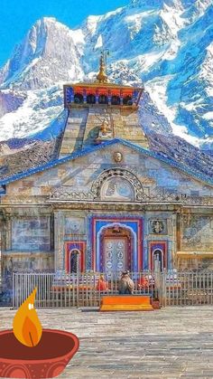 an old church with mountains in the background