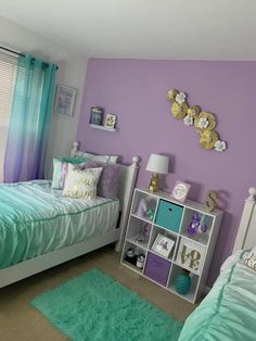 a bedroom with purple walls and green carpeted flooring, two twin beds in front of a window