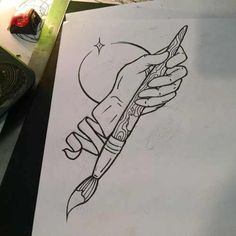 a drawing of a hand holding a paintbrush