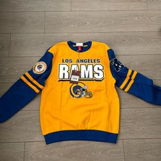 La Rams Crewneck Sweatshirt Size Small! Never Work! Oversized! Throwback Crew Neck Top For Game Day, Team Spirit Crew Neck Top With Ribbed Cuffs, Throwback Blue Tops With Letter Print, Throwback Blue Top With Letter Print, Blue Throwback Tops With Letter Print, Blue Throwback Sweatshirt With Graphic Print, Game Day Crew Neck Top With Ribbed Cuffs, Throwback Long Sleeve Tops For Game Day, Blue Crew Sweatshirt For Game Day