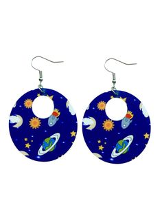 a pair of earrings with planets and stars on them