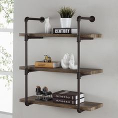 three tiered shelving unit with decorative items on top