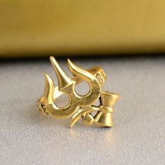 Om Shiv Trishul Ring, Brass Ring, Ohm Ring, Dainty Ring, Handmade Ring, Yoga Ring, Meditation Ring, Men's Ring, Gift For Her Size :- All Size Are Available METAL :- Brass ❥ Customers satisfaction is our biggest priority, please contact us with any questions/queries for future or existing orders, and we will do our best to make sure you are happy with your order. ♥ Please Make Sure to Include The Correct Address During Before Order. You Can return Item within 30 Days After Successful Delivery. We Offer 100% Money Back Guarantee If You Not Satisfied With Your Purchase. Return Charge Will Be Paid By Buyer Only. This is my shop link https://www.etsy.com/in-en/shop/AustereGifts?ref=seller-platform-mcnav Thank you🥰 for shopping with us! Om Rings For Women, Trishul Design, Ohm Ring, Shiva Trident, Gold Ring For Men, Yoga Ring, Gold Earrings For Men, Meditation Rings, Yoga Jewelry