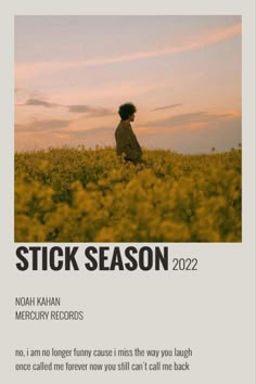 a person standing in a field with the words stick season on it