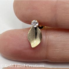 Gold filled Leaf stud earrings with CZ Cubic Zirconia stone , gold Leaf earrings , gold fill  Leaf stud earrings post  , ear nuts / clutches included  , earrings base , choose quantity 2 10 30 pieces 20% discount included in the listing , OR 0024 , SIZE: length with stone 12mm , wide: 7mm ,  Quantity: Select an option , Discount included in the listing 2 pieces (1 pair) 10 pcs (5 pairs) , 10% Discount 30 pcs (15 pairs) , 20% Discount Here you can find the most Stylish and Fashionable styles at a manufacture price . More Styles and Jewelry earrings are available in our Store Enter our shop: https://www.etsy.com/shop/goldfilledcreations Much higher quality and harder wearing than traditional gold-plated items. Gold filled, gold layered is nickel and lead free, items can last over time with t Leaf Earrings Gold, Gold Leaf Earrings, Stone Gold, Gold Filled Jewelry, Leaf Earrings, Earrings Gold, Jewelry Earrings Studs, Gold Leaf, Post Earrings