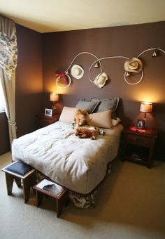 a dog laying on a bed in a bedroom