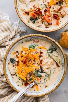 two bowls filled with soup on top of a table