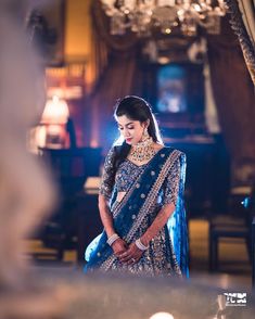 a woman in a blue bridal outfit