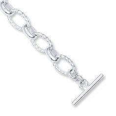 Polished and patterned oval links of sterling silver alternate in beautiful contrast to form this bracelet for her. The stylish 8.75-inch bracelet secures with a toggle clasp. Bracelet For Her, Jewelry Education, Jewelry Advice, Kay Jewelers, White Bracelets, Toggle Bracelet, Metal Chain Link, Bracelet Sterling Silver, Diamond Fashion