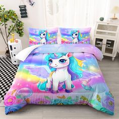 a bed room with a unicorn comforter and pillows