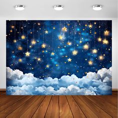 an empty room with wooden floors and stars in the sky