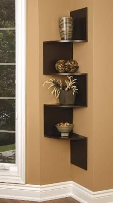 a corner shelf with three shelves on each side