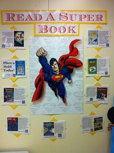 a bulletin board with a superman book on it's front and back cover that reads read a super book