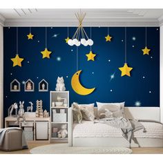 a child's bedroom with stars and moon wallpaper