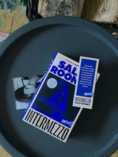 a book sitting on top of a black plate