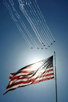 an american flag flying in the sky