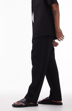 Textural rib lends depth to these edgy wide-leg trousers topped by a comfy elastic waist. 26 1/2" inseam; 14" leg opening; 13" front rise; 17 1/2" back rise (size Medium) Elastic waist Front slant pockets; back welt pockets 94% polyester, 6% elastane Machine wash, line dry Made in Turkey Ribbed Wide-leg Workwear Pants, Ribbed Wide-leg Pants For Work, Black Pants With Straight Hem For Spring, Black Straight Hem Pants For Spring, Relaxed Fit Wide Leg Ribbed Pants, Ribbed Workwear Pants, Ribbed Wide Leg Pants With Relaxed Fit, Ribbed Black Bottoms For Fall, Fall Black Ribbed Bottoms