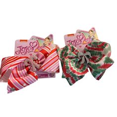 Make A Statement With This Jojo Siwa Girls Hair Bow Clip, Perfect For Parties, Casual Outings And Formal Events. The Multicolored Bows Features A Candy Canes On One And Diamond Bejeweled Accent On The Other One, Adding A Touch Of Sparkle To Any Hair Type. With A Set Of 2 Bows, This Accessory Is A Great Addition To Your Collection. The Christmas-Themed Striped And Tie Dye Pattern, Along With The Jojo Siwa Character Family Theme, Makes It A Must-Have For Any Young Girl's Hair Accessory Collection. Jojo Hair Bows, Jojo Siwa Hair, Burr Basket, Jojo Siwa Bows, Black Hair Bows, Jojo Bows, Halloween Hair Bows, Girls Hair Bow, Rainbow Bow