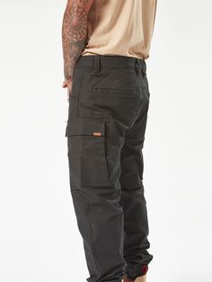 The Workwear Caliper Cuff Pants perfectly blend durability with comfort. They are made from a tough cotton-nylon-elastane stretch canvas with reinforced stress points to maintain the fit. The tapered leg and ankle cuff makes them easy to wear with any footwear your job requires, while multiple pockets keep all those on-the-job essentials close at hand. With Volcom Workwear’s signature style and robust construction, these pants are durable enough for the toughest jobs but stylish enough for every Backyard Ramp, Cuff Pants, Surfing Swimwear, Cuffed Pants, Snow Jacket, Work Pants, Big Boys, Calipers, Swimwear Tops