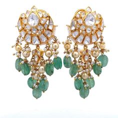 Experience the opulence of Traditional Indian style with our exquisite Chandbali Earring, expertly crafted in 925 Sterling silver and adorned with fine quality Moissanite, Green stone, and Pearls. This stunning piece radiates elegance and grace, transporting you to the vibrant world of Bollywood glamour.  With its high carat gold plating and push-back closure, this earring promises durability and a secure fit, perfect for any occasion. Whether dressing up or adding a touch of cultural flair to y Elegant Green Danglers For Reception, Luxury Earrings With Intricate Design For Festivals, Elegant Sterling Silver Earrings For Diwali, Elegant Green Chandelier Earrings For Diwali, Elegant Festive Hallmarked Chandbalis, Elegant Hallmarked Kundan Jhumkas, Elegant Kundan Hallmarked Jhumkas, Elegant Sterling Silver Chandbalis For Festive Occasions, Luxury Chandbali Earrings For Festivals