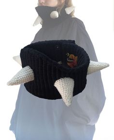 a woman wearing a knitted hat with horns on it