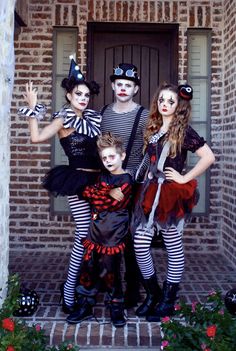 three people in costumes posing for a photo