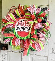 a watermelon wreath with the words hello summer on it