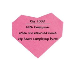 a pink heart shaped paper with words written on it