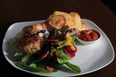 a white plate topped with food and chips