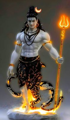 a statue of the hindu god maha with an orange flame in his hand and holding a staff