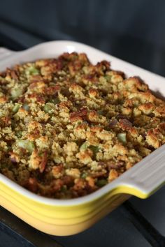 a casserole dish filled with stuffing on top of a stove burner oven