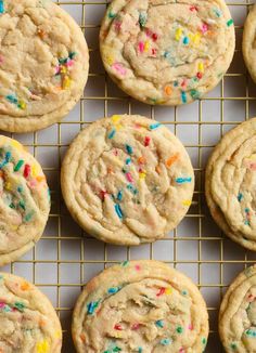 several cookies with sprinkles on a cooling rack