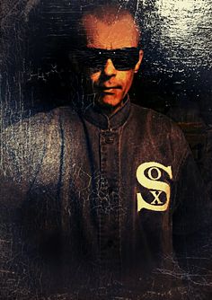 a man wearing sunglasses and a baseball uniform with the letter s on it's chest